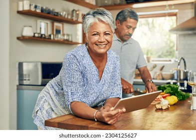 Portrait of old woman in kitchen with man, tablet and cooking healthy food together in home. Digital recipe, smile and senior couple in house with meal prep, happiness and wellness diet in retirement - Powered by Shutterstock