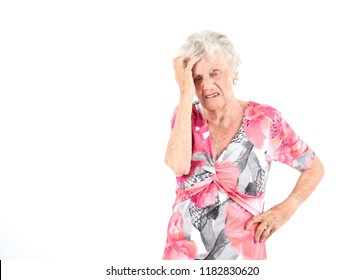 Portrait Of An Old Woman Scratching Her Head Against A White Background