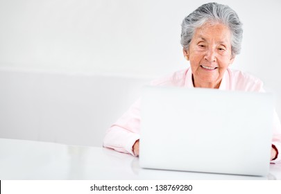 Portrait Of An Old Woman Using A Computer