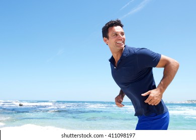 Portrait Of An Older Male Fashion Model Enjoying The Beach