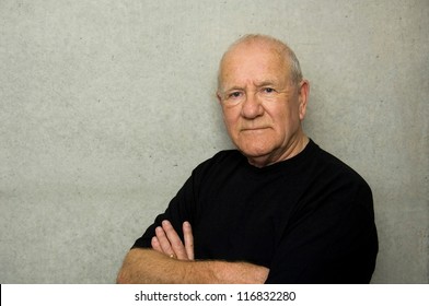 Portrait Of An Older Man Wearing Black T-shirt