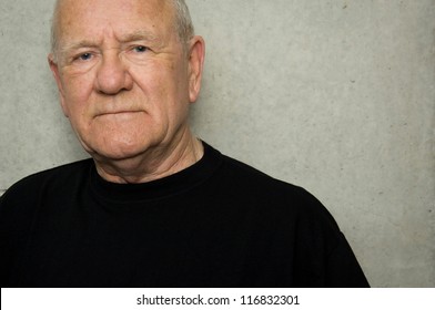 Portrait Of An Older Man Wearing Black T-shirt