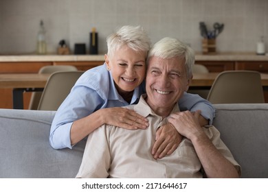 Portrait Older Wife Hugs Husband Laughing, Spend Time Together. Eternal Love, Romantic Relations, Understanding Between Mature Spouses. Medical Insurance Cover For Seniors, Happy Retired Life Concept