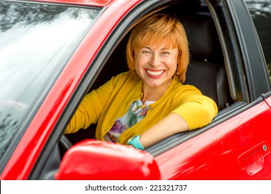 Portrait Of Older Woman Driving A Car