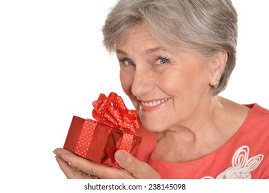 Portrait An Older Woman With A Gift On A White Background