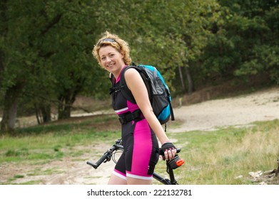 Portrait Of An Older Woman Smiling With Bicycle