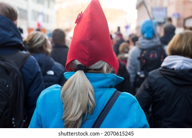 Portrait On Back View Of Woman Wearing A French Revolutionary Hat In The Street