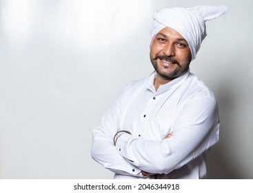 Portrait On Indian Young Rural Man In White Traditional Dress With Turban 