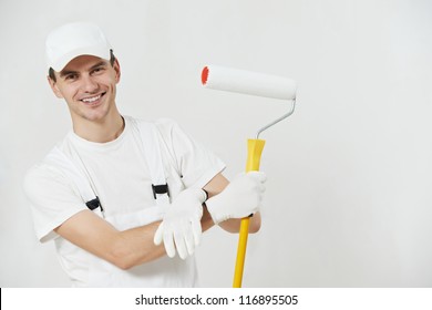 Portrait of one male house painter worker with painting roller