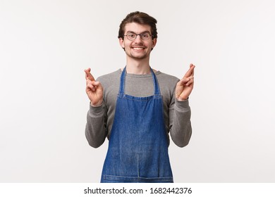 Portrait Of Optimistic Excited, Hopeful Young Small Business Owner, Coffee Shop Employee Look Happy Smiling Camera, Cross Fingers For Good Luck, Make Wish, Dream Come True, White Background