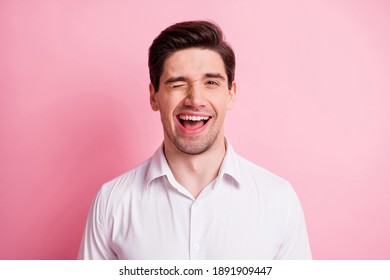 Portrait Of Optimistic Guy Blink Wear White Shirt Isolated On Pink Color Background