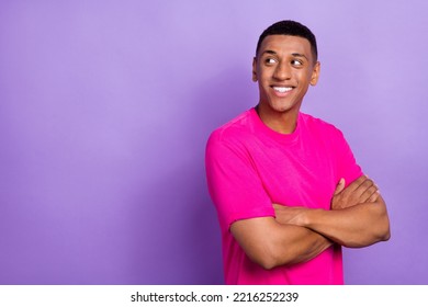 Portrait of optimistic satisfied man with fade haircut wear pink t-shirt arms crossed look empty space isolated on violet color background - Shutterstock ID 2216252239