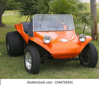 Portrait Of An Orange Beach Buggy Car.