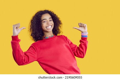 Portrait of overjoyed African American girl teenager in casual wear isolated on yellow studio background point at herself. Smiling biracial teen kid have fun show identity or personality. Diversity. - Powered by Shutterstock