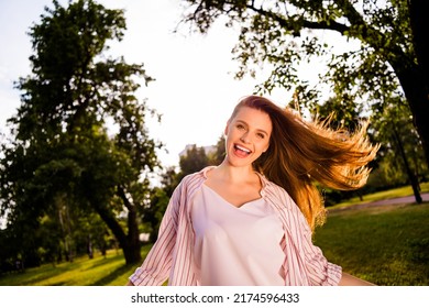 Portrait Of Overjoyed Pretty Lady Toothy Smile Flying Hair Enjoy Warm Sunny Weather Outside