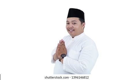 Portrait Of Overweight Muslim Man With Head Cap Or Songkok Smile  And Greeting At Camera