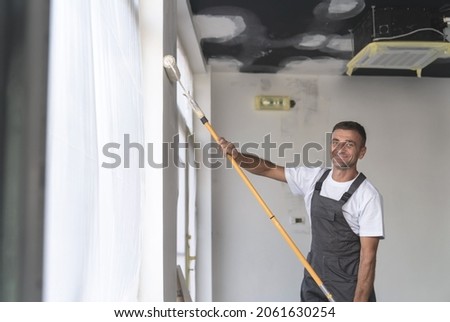 Portrait of a painter with a painting tool