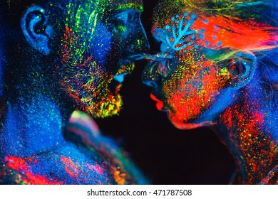 Portrait of a pair of lovers painted in fluorescent powder.