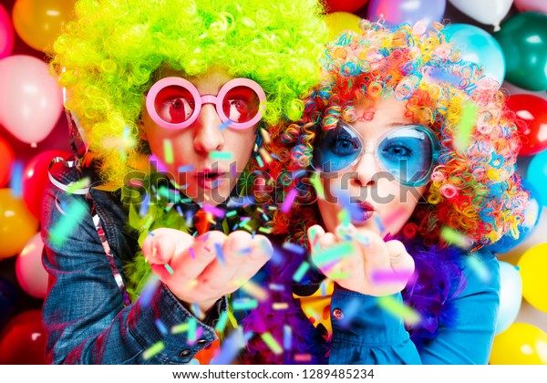 Portrait of party Men and woman in wig and\
glasses Carneval