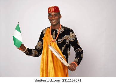 Portrait of patriotic Nigerian man waving the national flag