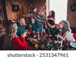 Portrait of peaceful big family sit table play piggyback enjoy celebrate new year xmas flat indoors