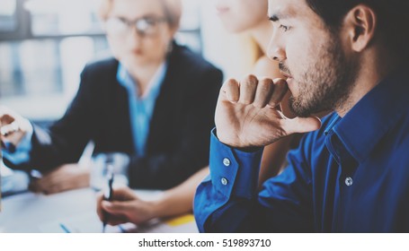 Portrait Of Pensive Hispanic Businessman On The Business Meeting With Partners In Modern Office.Horizontal,blurred Background