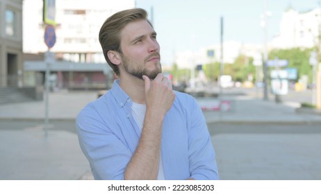 Portrait Of Pensive Man Thinking Outdoor