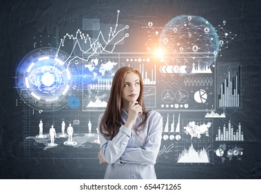 Portrait of a pensive young business analyst standing against a dark background with graphs and infographics. Toned image. Elements of this image furnished by NASA - Powered by Shutterstock