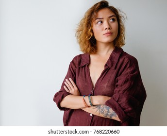 Portrait Of Pensive Young Woman In Oversized Shirt