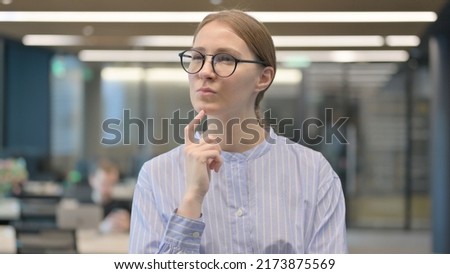 Portrait of Pensive Young Woman Thinking