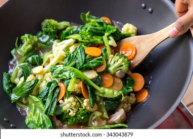 Portrait Of People Cooking Healthy Vegetarian Chinese Food Capcay