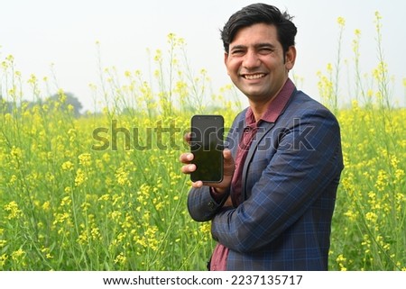 Portrait of people enjoying and making cute face at mustard field