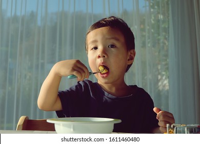 Portrait Photo Adorable Young Boy Eating Stock Photo 1611460480 ...