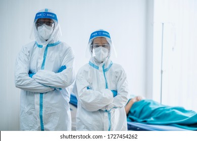 Portrait Photo Of Asian Doctor Wearing Ppe Suit And Face Mask In Hospital. Corona Virus, Covid-19, Virus Outbreak, Medical Mask, Hospital, Quarantine Or Virus Outbreak Concept