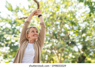 Portrait photo of happy senior Caucasian woman relaxing and breathing fresh air with sunlight in outdoors park. Elderly woman enjoying a day in the park on summer. Healthcare lifestyle and wellness  - Powered by Shutterstock