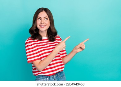 Portrait photo of young adorable cute nice girlish lady interested finger pointing empty space look new salon veneers isolated on aquamarine color background - Shutterstock ID 2204943453