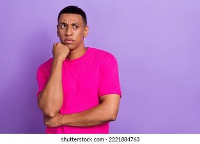 Portrait photo of young minded ponder deep think man student thinking about solution his problems looking empty space ad isolated on violet color background - Shutterstock ID 2221884763