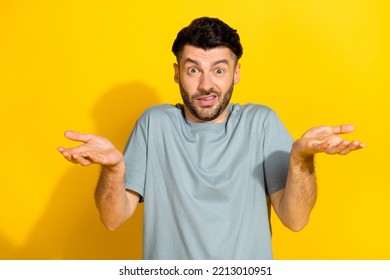 Portrait Photo Of Young Nervous Excited Bearded Brunet Guy Dont Know Shrug Shoulders Palms No Idea How Works Mechanism Isolated On Yellow Color Background