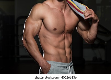 Portrait Of A Physically Fit Man Posing With Towel