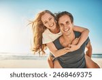 Portrait, piggy back and seaside with couple, love and sunshine with happiness, adventure and romance. Face, beach and man carrying woman with vacation, getaway trip or summer with honeymoon or smile