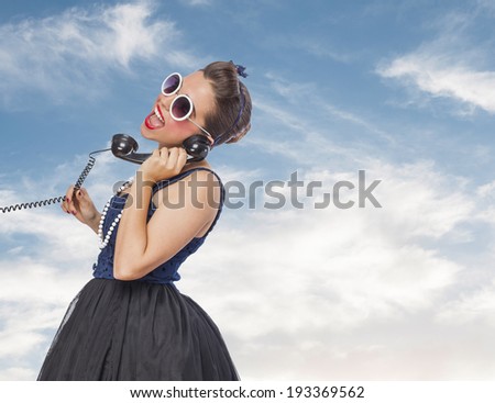 portrait of a pin up woman talking on telephone