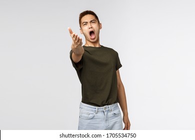 Portrait Of Pissed-off Complaining, Bothered Asian Man Pointing With Dismay At Camera And Accuse Someone, Look Angry And Outraged, Blame Person, Judging Bad Behaviour, Look At This Mess