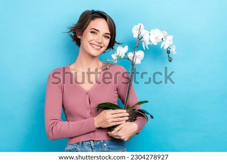 Similar – Image, Stock Photo Woman holding pink orchid