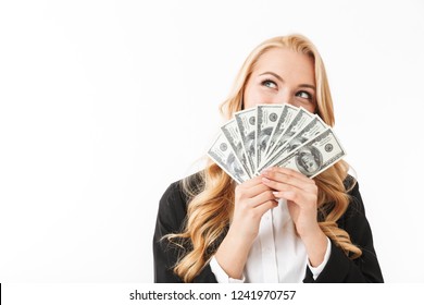 Portrait Of Pleased Woman Wearing Office Clothing Holding Fan Of Money Isolated Over White Background