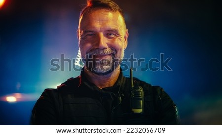 Portrait of Police Officer Looking at the Camera and Smiling Friendly. Officer of the Law Maintains Public Order and Safety, Prevents and Investigates Criminal Activity, Helps and Saves People