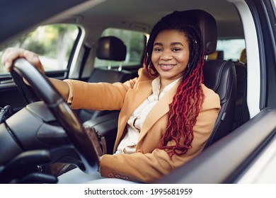 Portrait Of Positive African American Lady Inside The Car