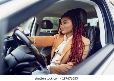 Portrait Of Positive African American Lady Inside The Car