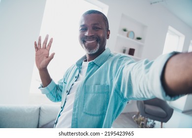 Portrait Of Positive Aged Man Make Selfie Vlogging Greeting His Blog Followers In Modern House Apartment