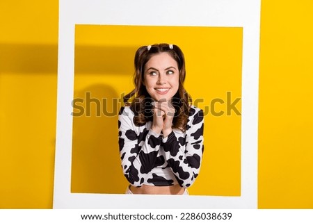 Portrait of positive cheerful cowgirl posing photographing in photo zone isolated on vivid color background