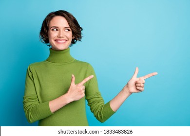 Portrait of positive cheerful girl promoter point index finger copyspace demonstrate adverts promo recommend suggest select wear jumper isolated over blue color background - Powered by Shutterstock - Get 15% off with code: PIKWIZARD15